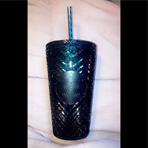 Bluish green Starbucks cup